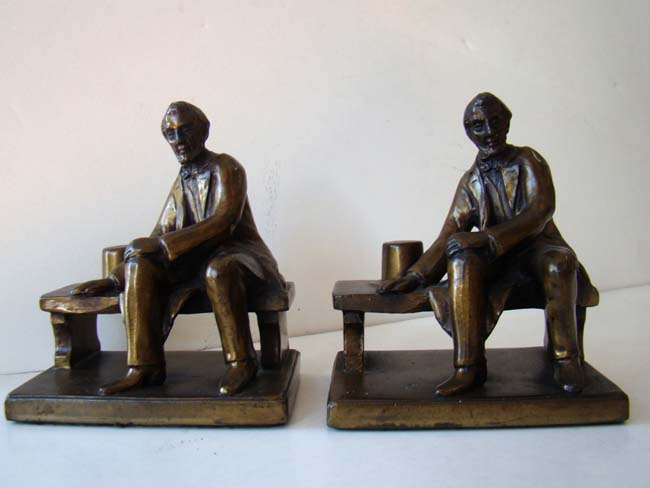 A nice small pair of bronze bookends circa 1935 depicting Abraham Lincoln sitting on a bench